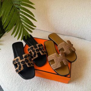 Hermès Oran sandals with a distinctive "H" cut-out design.